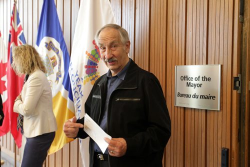 RUTH BONNEVILLE / WINNIPEG FREE PRESS  Martin Johnson, Executive Director, Fire Fighters Burn Fund shows off his cheque that his charity received from Winnipeg Mayor Brian Bowman for the 2016 State of the City Proceeds at City Hall Friday.     May 27,  2016