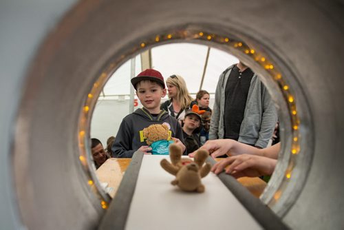 MIKE DEAL / WINNIPEG FREE PRESS Jake Penner, 7, watches his BearBear as it goes into the CT Scanner while at the Teddy Bears Picnic at Assiniboine Park Sunday. 160529 - Sunday, May 29, 2016