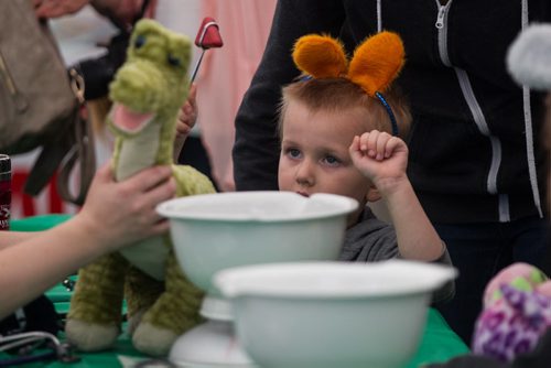 MIKE DEAL / WINNIPEG FREE PRESS Jane Mondor, 3, helps give Dino a check up while at the Teddy Bears Picnic at Assiniboine Park Sunday. 160529 - Sunday, May 29, 2016