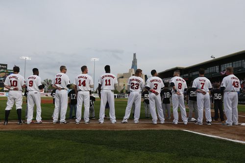 JOHN WOODS / WINNIPEG FREE PRESS The Goldeye starting lineup line up for O Canada at the Winnipeg Goldeyes home opener against the Sioux Falls Canaries Monday, May 30, 2016.