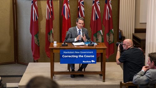 MIKE DEAL / WINNIPEG FREE PRESS Manitoba's Finance Minister Cameron Friesen discusses the budget with media who are in lockup prior to the release of the new governments first budget in the Manitoba Legislature Tuesday afternoon. 160531 - Tuesday, May 31, 2016