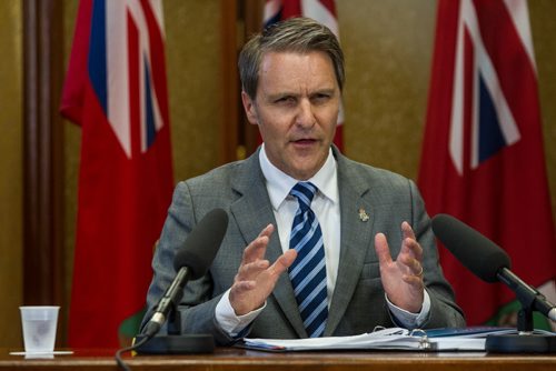 MIKE DEAL / WINNIPEG FREE PRESS Manitoba's Finance Minister Cameron Friesen discusses the budget with media who are in lockup prior to the release of the new governments first budget in the Manitoba Legislature Tuesday afternoon. 160531 - Tuesday, May 31, 2016