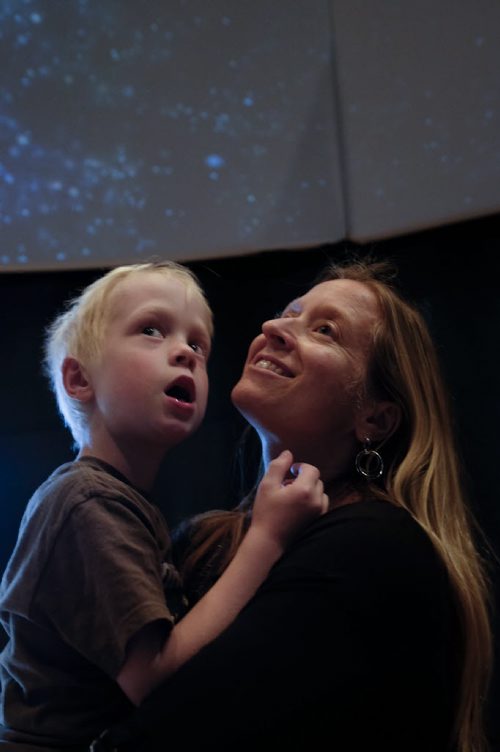 ZACHARY PRONG / WINNIPEG FREE PRESS  Sophie Siemens and her son Julian, 7, watch a video installation in the 360-degree theatre at the Canadian Museum of Human Rights' Indigenous Perspectives Gallery on Tuesday, May 31, 2016. Siemans and her children are visiting from Ottawa and it was their first time at the museum. Its pretty awesome, said Siemans. It was an amazing opportunity. Theres a lot of visual learning that can go on.