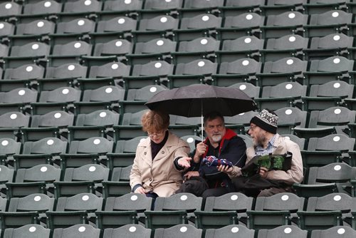 JOHN WOODS / WINNIPEG FREE PRESS Bev Phillips, Dave Barber and Howard Curl wonder if the game between the Winnipeg Goldeyes and Sioux Falls Canaries will be called off due to rain in Winnipeg Tuesday, May 31, 2016.