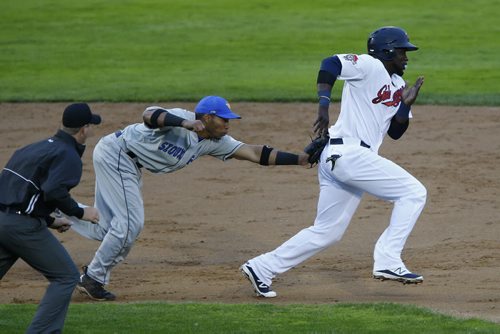 JOHN WOODS / WINNIPEG FREE PRESS Winnipeg Goldeyes Reggie Abercrombie (11) gets tagged out by Sioux Falls Canaries Frank Martinez (10) as he gets caught trying to steal third during their game in Winnipeg Tuesday, May 31, 2016.
