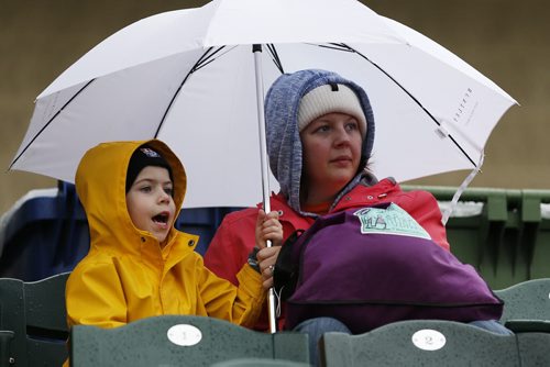 JOHN WOODS / WINNIPEG FREE PRESS Jennifer Auringer and her son Alex came prepared for rain at the game between the Winnipeg Goldeyes and Sioux Falls Canaries in Winnipeg Tuesday, May 31, 2016.