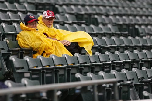 JOHN WOODS / WINNIPEG FREE PRESS Louise and Garry Watson came prepared for rain at the game between the Winnipeg Goldeyes and Sioux Falls Canaries in Winnipeg Tuesday, May 31, 2016.