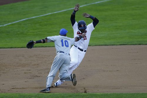 JOHN WOODS / WINNIPEG FREE PRESS Winnipeg Goldeyes Reggie Abercrombie (11) avoids the tag by Sioux Falls Canaries Frank Martinez (10) as he gets caught trying to steal third during their game in Winnipeg Tuesday, May 31, 2016.