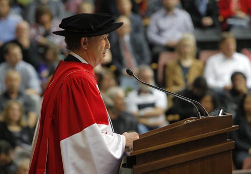 BORIS MINKEVICH / WINNIPEG FREE PRESS 2016 Spring Convocation, the University of Manitoba will confer degrees, diplomas and certificates on 3,040 graduates. This is the largest graduating class since 1977. During Convocation, honorary degrees are awarded for distinguished achievement. Candidates for honorary degrees are nominated by members of the University and the public. The 137th annual Spring Convocation of the University of Manitobain the Investors Group Athletic Centre (IGAC) Gerald Schwartz, left, received an Honorary Doctor of Laws and speaks to the grads at the event. June 1, 2016.