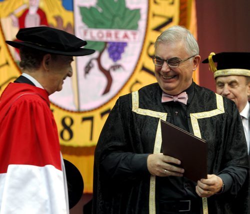 BORIS MINKEVICH / WINNIPEG FREE PRESS 2016 Spring Convocation, the University of Manitoba will confer degrees, diplomas and certificates on 3,040 graduates. This is the largest graduating class since 1977. During Convocation, honorary degrees are awarded for distinguished achievement. Candidates for honorary degrees are nominated by members of the University and the public. The 137th annual Spring Convocation of the University of Manitobain the Investors Group Athletic Centre (IGAC) Gerald Schwartz received an Honorary Doctor of Laws. U of M President David Barnard, right, presenting it. June 1, 2016.