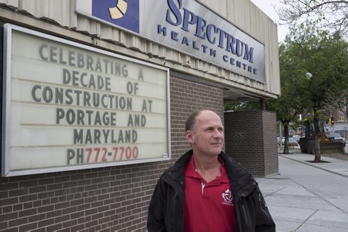 ZACHARY PRONG / WINNIPEG FREE PRESS  Dr. Gordon Partridge, co-owner of Spectrum Health Care on Portage Ave., was angered by the effect constant construction has had on his business. He made a sarcastic sign reading Celebrating a Decade of Construction at Portage and Maryland to draw attention to the issue. Story by Aidan Geary.  June 1, 2016.