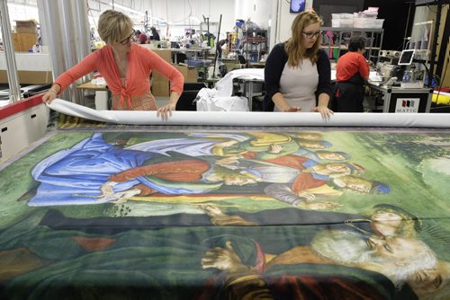 ZACHARY PRONG / WINNIPEG FREE PRESS  Alex Vanderhooft and Brandi Hutlet roll up a reproduction of artwork from the Sistine Chapel for shipment to Mexico City at Valley Fashions on Monday, May 30, 2016.