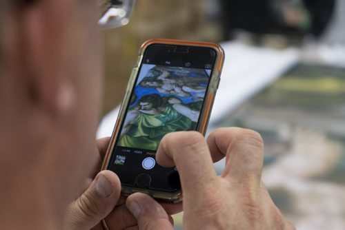 ZACHARY PRONG / WINNIPEG FREE PRESS  Dan Coates takes a photo of one of the reproductions of art from the Sistine Chapel on June 1, 2016.