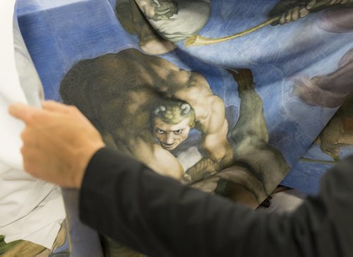 ZACHARY PRONG / WINNIPEG FREE PRESS  An employee at Valley Fashions folds a reproduction of art from the Sistine Chapel on June 1, 2016.