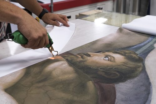 ZACHARY PRONG / WINNIPEG FREE PRESS  Dan Coates trims a reproduction of art from the Sistine Chapel printed on polyester based cloth at Valley Fashions on Wednesday, June 1, 2016.