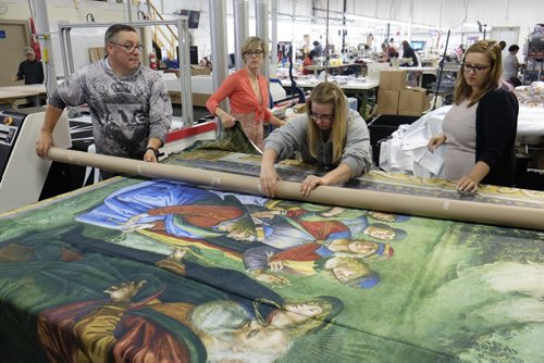 ZACHARY PRONG / WINNIPEG FREE PRESS  Employees roll up a reproduction of artwork from the Sistine Chapel for shipment to Mexico City at Valley Fashions on Monday, May 30, 2016.