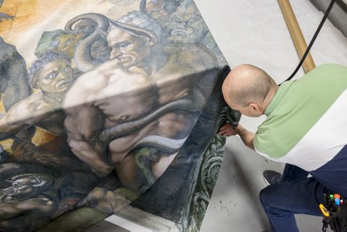 ZACHARY PRONG / WINNIPEG FREE PRESS  An employee prepares a reproduction of art from the Sistine Chapel on June 1, 2016.