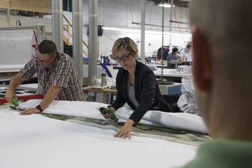 ZACHARY PRONG / WINNIPEG FREE PRESS  Alex Vanderhooft and Dan Coates trim a reproduction of artwork from the Sistine Chapel on Wednesday, June 1, 2016.