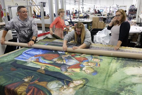 ZACHARY PRONG / WINNIPEG FREE PRESS  Employees roll up a reproduction of artwork from the Sistine Chapel for shipment to Mexico City at Valley Fashions on Monday, May 30, 2016.