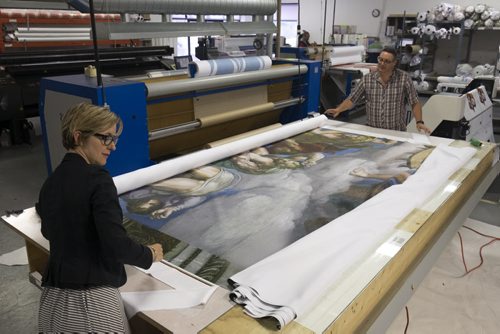 ZACHARY PRONG / WINNIPEG FREE PRESS  Alex Vanderhooft and Dan Coates roll up a reproduction of artwork from the Sistine Chapel for shipment to Mexico City at Valley Fashions on Wednesday, June 1, 2016.