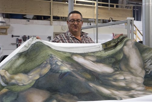 ZACHARY PRONG / WINNIPEG FREE PRESS  Dan Coates rolls up a reproduction of artwork from the Sistine Chapel at Valley Fashions on Wednesday, June 1, 2016.