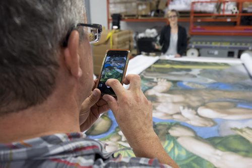 ZACHARY PRONG / WINNIPEG FREE PRESS  Dan Coates takes a reproduction of artwork from the Sistine Chapel at Valley Fashions on Wednesday, June 1, 2016.