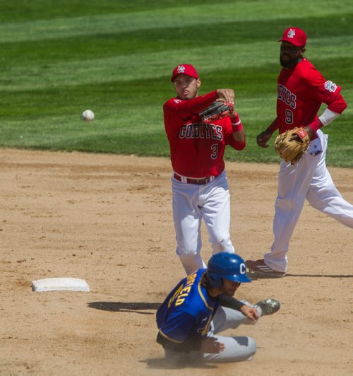 MIKE DEAL / WINNIPEG FREE PRESS Winnipeg Goldeyes' shortstop Maikol Gonzalez (3) goes for a double play after basing out Sioux Falls Canaries' Cameron Garfield (5) at Shaw Park Thursday afternoon. 160602 - Thursday, June 02, 2016