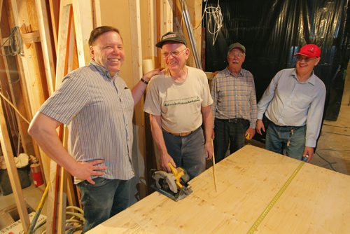 BORIS MINKEVICH / WINNIPEG FREE PRESS  Naomi House under construction. 700-702 Ellice Ave.  Pastor Tim Nielsen, far left,  poses for a photo inside the place that is under construction  it will soon be temporary housing for refugees and refugee claimants and is connected to City Church. Next to him L-R is volunteer builders Tom Fox, Orly Friesen, Bernie Bilecki.  It will be much-needed housing for growing number of newcomers arriving in Winnipeg. SANDERS story. June 2, 2016.