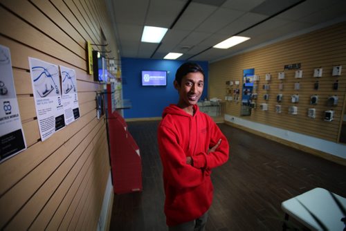 RUTH BONNEVILLE / WINNIPEG FREE PRESS  SUBJECT: Kyle Jagassar, photographed in his newly opened St. Vital store is a 17-year-old high school student/business owner. He started his cellphone repair company, Matrix Mobile, from his bedroom two years ago and now has two stores, seven employees and brings in $30-40K per month.  June 01, 2016