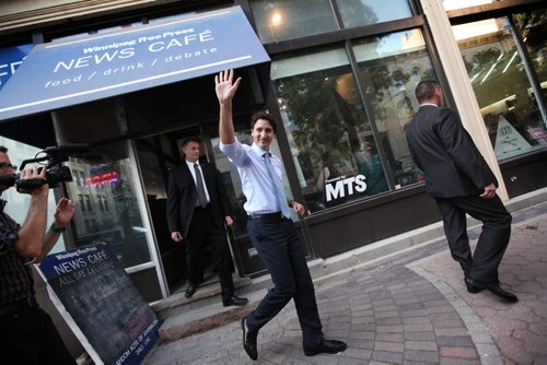 RUTH BONNEVILLE / WINNIPEG FREE PRESS  Prime Minister Justin Trudeau waves as he leaves the Winnipeg Free Press News Cafe where he was nterviewed by WFP editor Paul Samyn and meeting students from Children of the Earth high school Thursday.  June 02 / 2016