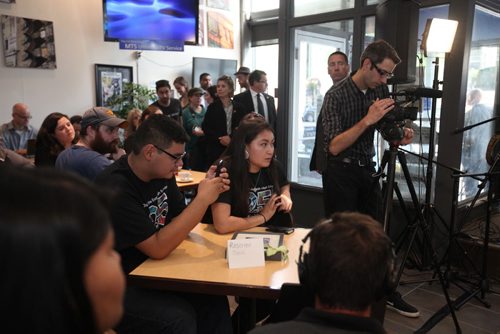 RUTH BONNEVILLE / WINNIPEG FREE PRESS  High School students from Children of the Earth School listen to Prime Minister Justin Trudeau being interviewed by WFP Editor Paul Samyn while video taping it on his phone at the Winnipeg Free Press News Cafe Thursday.  June 02 / 2016