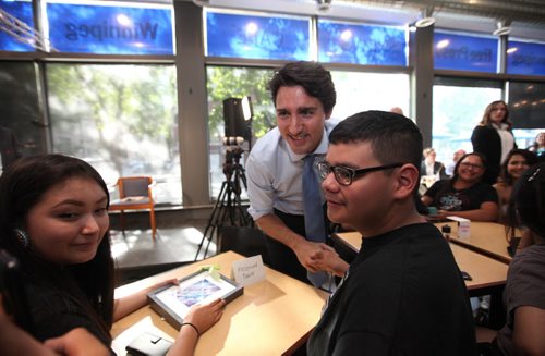 RUTH BONNEVILLE / WINNIPEG FREE PRESS  Gordon Parisian of Children of the Earth School takes a selfie with Prime Minister Justin Trudeau  at the Winnipeg Free Press News Cafe Thursday.  June 02 / 2016