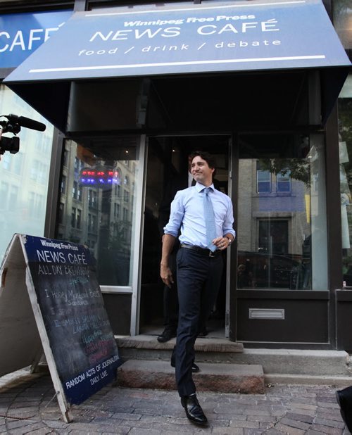 RUTH BONNEVILLE / WINNIPEG FREE PRESS  Prime Minister Justin Trudeau leaves the Winnipeg Free Press News Cafe after being interviewed by WFP editor Paul Samyn and meeting students from Children of the Earth high school Thursday.  June 02 / 2016