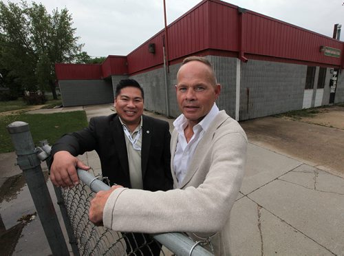PHIL HOSSACK / WINNIPEG FREE PRESS -  Pan Am Boxing' Harry Black and City Councillor Mike Pagtakhan pose in front of the Burrows Resource Centre which is being turned into a boxing club for local youth. The City is providing ongoing funding for the facility, which will open in September. See Geoff Kirbyson's tale. June 3, 2016