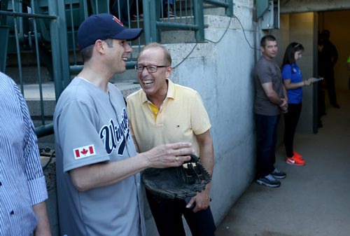 TREVOR HAGAN / WINNIPEG FREE PRESS Mayor Brian Bowman speaks with former mayor Sam Katz before he threw out the ceremonial pitch prior to the Goldeyes game on Diversity Day at Shaw Park, Saturday, June 4, 2016.