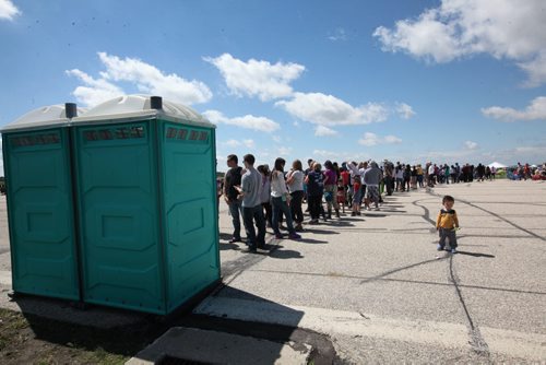 RUTH BONNEVILLE / WINNIPEG FREE PRESS  People attending the Manitoba Airshow wait in long lineups to use the port-a-potties in Southport near Portage Saturday.  See Kevin's story.    June 04 / 2016