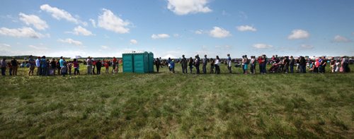 RUTH BONNEVILLE / WINNIPEG FREE PRESS  People attending the Manitoba Airshow wait in long lineups to use the port-a-potties in Southport near Portage Saturday.  See Kevin's story.    June 04 / 2016