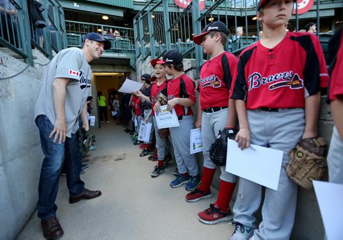 TREVOR HAGAN / WINNIPEG FREE PRESS Mayor Brian Bowman speaks with members of the Oakbank Braves after he threw out the ceremonial first pitch on Diversity Day at Shaw Park prior to the Winnipeg Goldeyes game, Saturday, June 4, 2016. For Tuesday ENT front