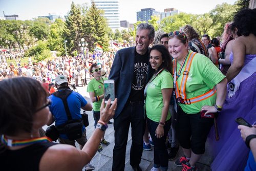 MIKE DEAL / WINNIPEG FREE PRESS Premier Brian Pallister gets his photo taken with Mona Mousa (centre) and Amanda Pratt (right)  on the steps of the Manitoba Legislative Building before the start of the Pride Parade Sunday. 160605 - Sunday, June 05, 2016