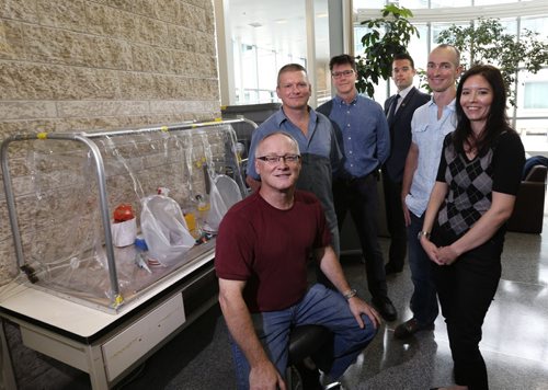 WAYNE GLOWACKI / WINNIPEG FREE PRESS   Seated is Allen Grolla,  Biologist, Diagnostics Lead, Special Pathogens, with from left, Dr. Paul Sandstrom, Director of the National HIV Laboratory, Dr. Jim Strong, Head, Diagnostics and Therapeutics, Special Pathogens, Dr. Matthew Gilmour, Scientific Director General, Yvon Deschambault, Lab Technician, Bloodborne Pathogens & Hepatitis and Dr. Heidi Wood, Chief, Rabies & Rickettsia at the National Microbiology Lab. All  except for Dr. Gilmour in this group had been deployed to West Africa as part of the Bio Response Team. They are beside a mobile lab. Mia Rabson story  June 6   2016