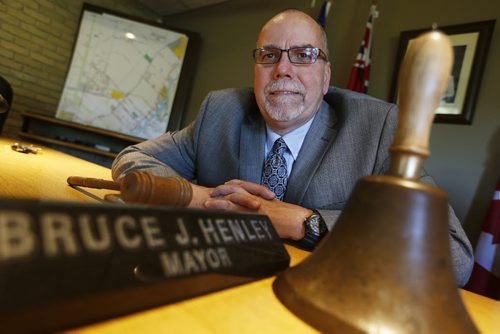JOHN WOODS / WINNIPEG FREE PRESS West St Paul mayor Bruce Henley is photographed with a bell in the municipal offices Monday, June 6, 2016.