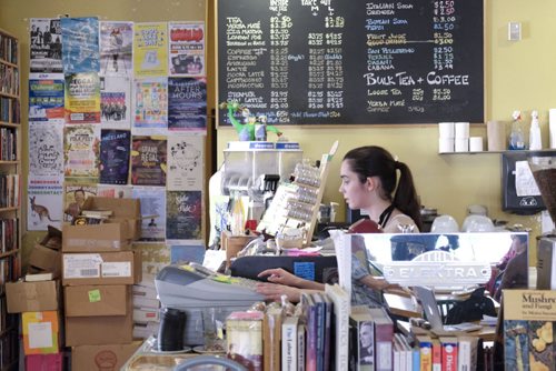 ZACHARY PRONG / WINNIPEG FREE PRESS  Arden Pruden, a barista at the Neighbourhood Cafe on Westminster Ave., where members of the community can make use of their poster board. June 7, 2016.