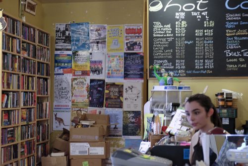 ZACHARY PRONG / WINNIPEG FREE PRESS  Arden Pruden, a barista at the Neighbourhood Cafe on Westminster Ave., where members of the community can make use of their poster board. June 7, 2016.