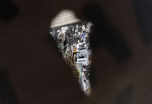 ZACHARY PRONG / WINNIPEG FREE PRESS  A community poster board seen through the hole of a torn flyer on Westminster Ave. Tuesday, June 7, 2016.