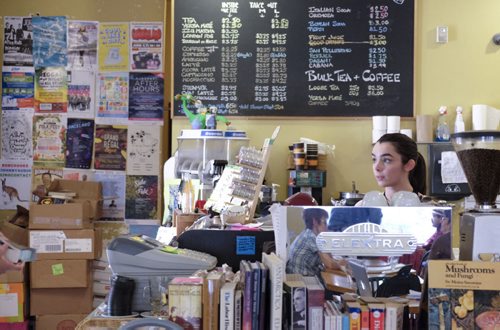 ZACHARY PRONG / WINNIPEG FREE PRESS  Arden Pruden, a barista at the Neighbourhood Cafe on Westminster Ave., where members of the community can make use of their poster board. June 7, 2016.