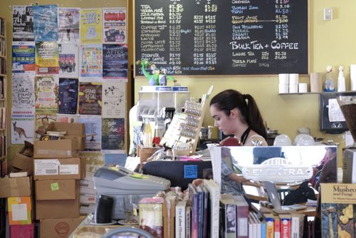 ZACHARY PRONG / WINNIPEG FREE PRESS  Arden Pruden, a barista at the Neighbourhood Cafe on Westminster Ave., where members of the community can make use of their poster board. June 7, 2016.