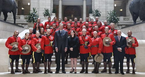 WAYNE GLOWACKI / WINNIPEG FREE PRESS      In centre, Premier Brian Pallister and Heather Stefanson, Minister of Justice and Attorney General with members of the RCMP "D" Division who attended the Order of the Buffalo Hunt ceremony in the Manitoba Legislative Bld. Tuesday.  A total of 65 members were deployed to Fort McMurray at the height of the wildfires.  The Order of the Buffalo Hunt is the highest honour the province can bestow to individuals who have demonstrated outstanding skills in the areas of leadership, service and community commitment. Aidan Geary story.   June 7  2016