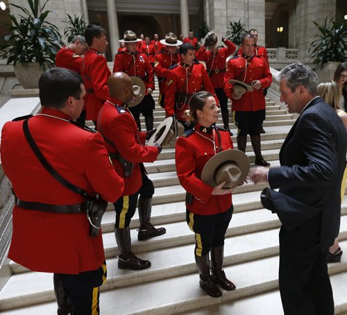WAYNE GLOWACKI / WINNIPEG FREE PRESS       Premier Brian Pallister speaks to RCMP Const. Sabrina Whall before the group photo with members of the RCMP "D" Division who attended the Order of the Buffalo Hunt ceremony in the Manitoba Legislative Bld. Tuesday.  A total of 65 RCMP members were deployed to Fort McMurray at the height of the wildfires.  The Order of the Buffalo Hunt is the highest honour the province can bestow to individuals who have demonstrated outstanding skills in the areas of leadership, service and community commitment. Aidan Geary story.   June 7  2016