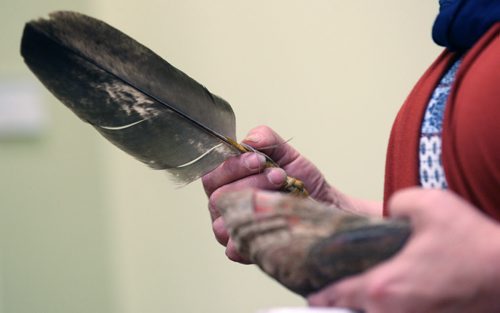 JOE BRYKSA / WINNIPEG FREE PRESS  Closing ceremony for the Winnipeg Hearing Centre where confidential hearing where done for survivors of Indian Residential Schools- 391 York St, 2nd Floor- Debbie Cielen shows eagle feather that was in Hearing Centre since it opened - June 07 , 2016.(See Alex Paul  story)
