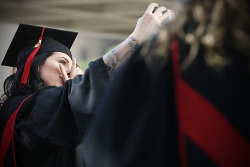 JOHN WOODS / WINNIPEG FREE PRESS Madelynn Sisetski, who graduated in Medical Reprocessing Technician takes a last minute selfie prior to the Red River College spring convocation ceremony at the Centennial Concert Hall Tuesday, June 7, 2016.